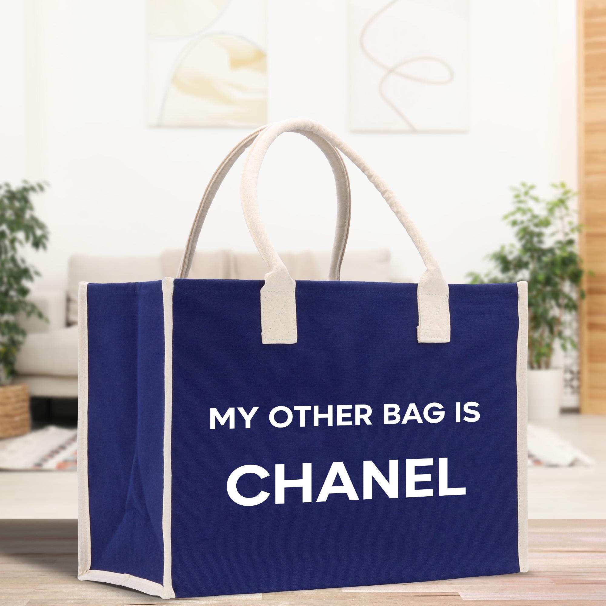 a blue bag that says, my other bag is chanel