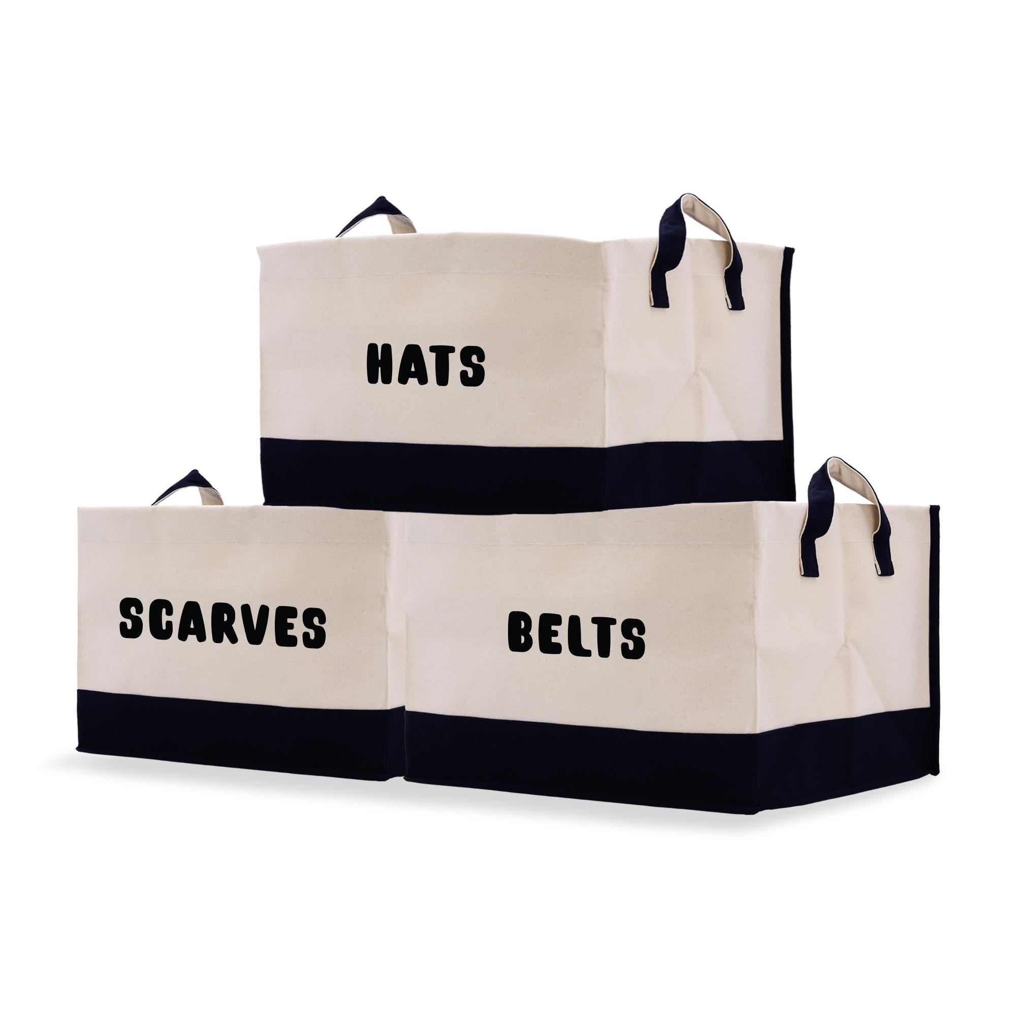 two black and white bags that say hats, scarves, and belts