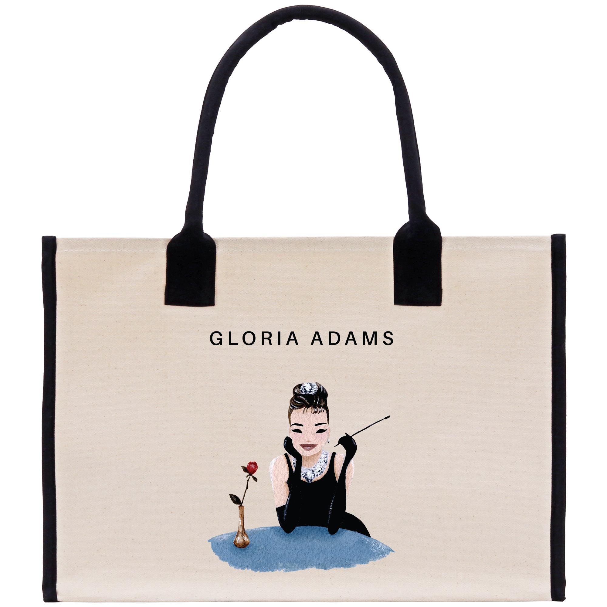 a handbag with a picture of a woman holding a rose