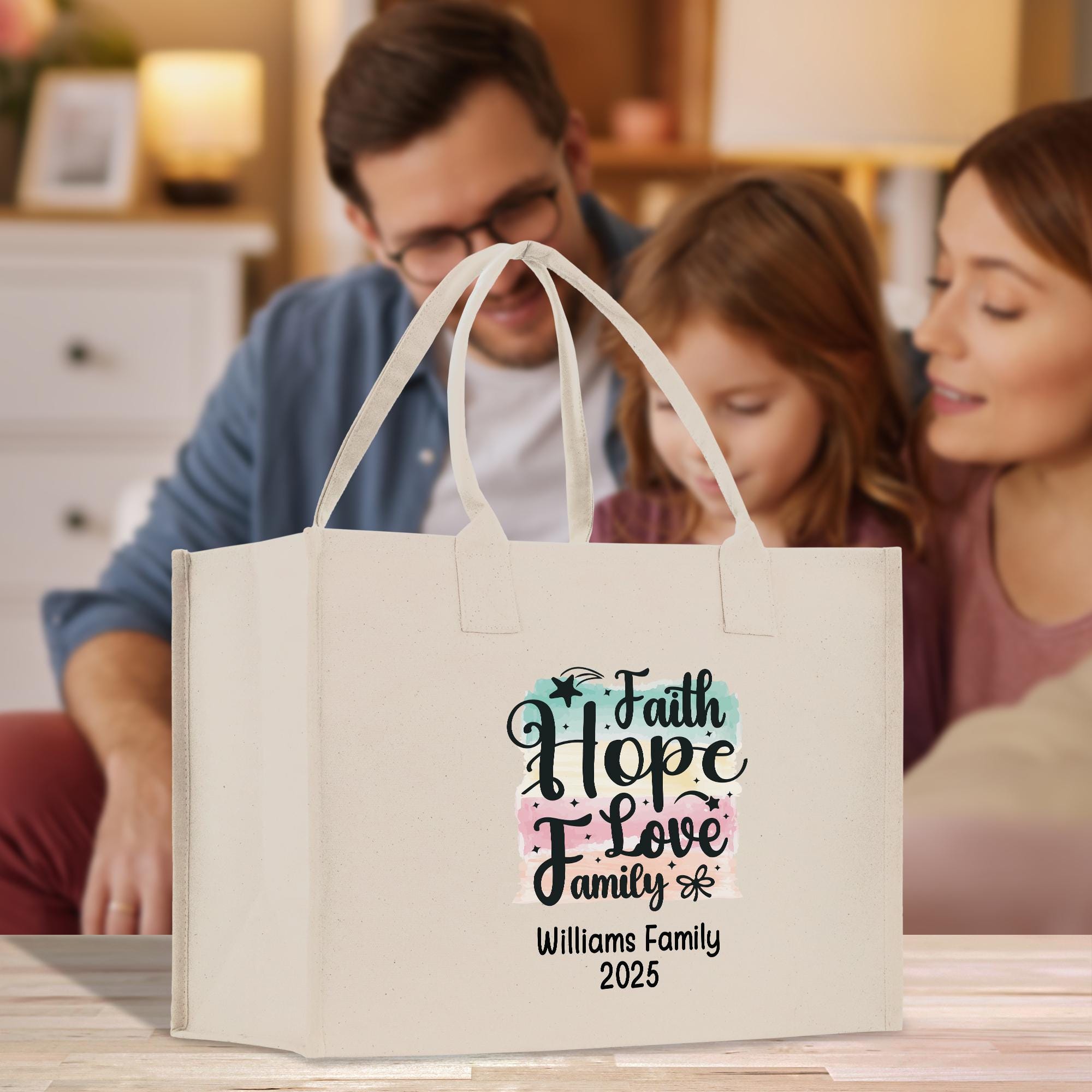 A family of three - a man, a woman, and a young girl - are gathered around a white tote bag with a printed message on it.