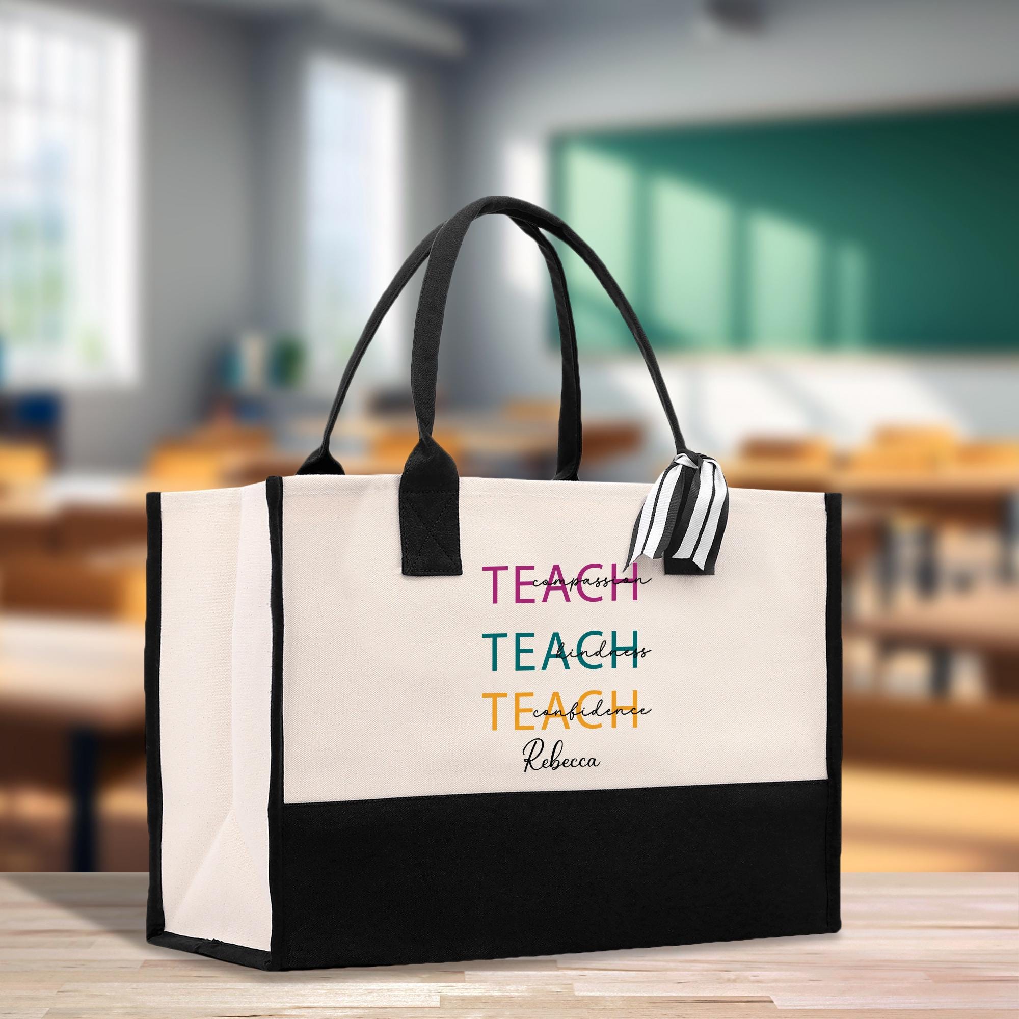 a black and white bag with a teacher&#39;s name on it