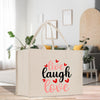 a canvas bag that says live laugh love