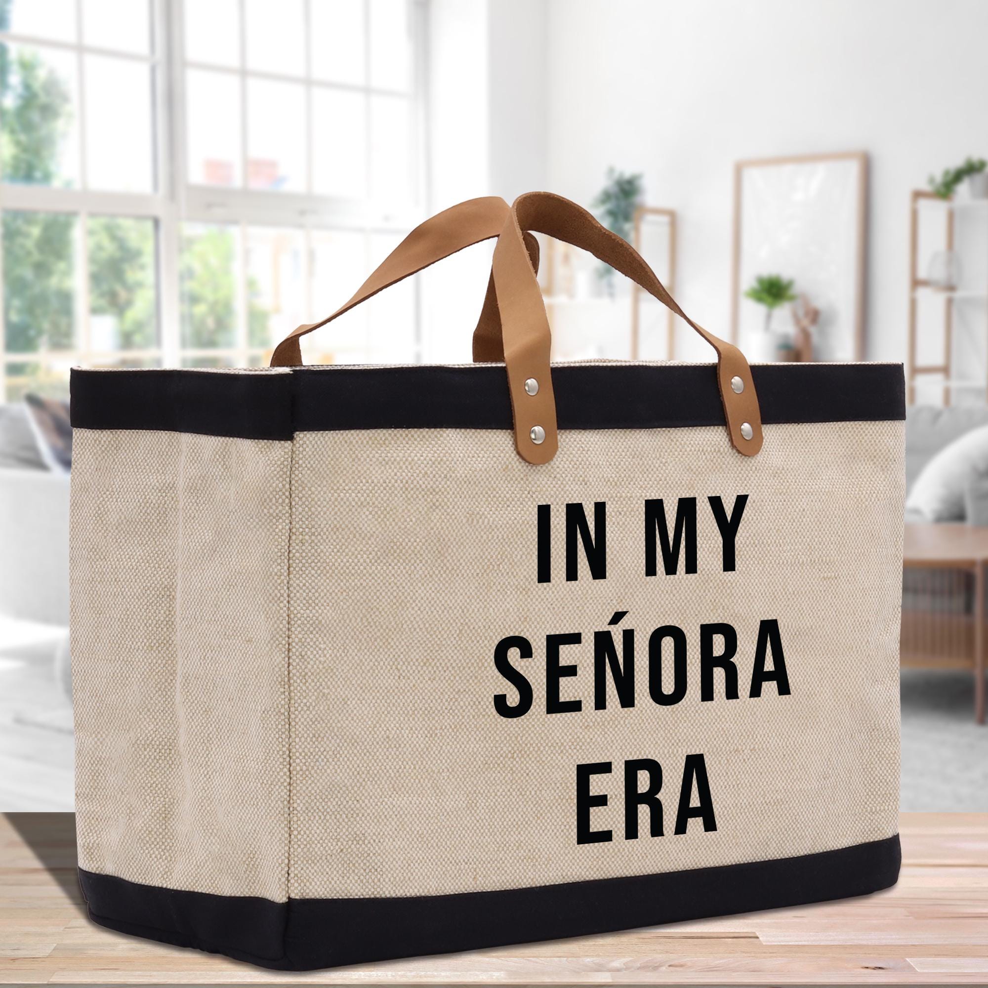 a canvas tote bag with a leather handle that says in my senior era