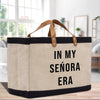 a canvas tote bag with a leather handle that says in my senior era