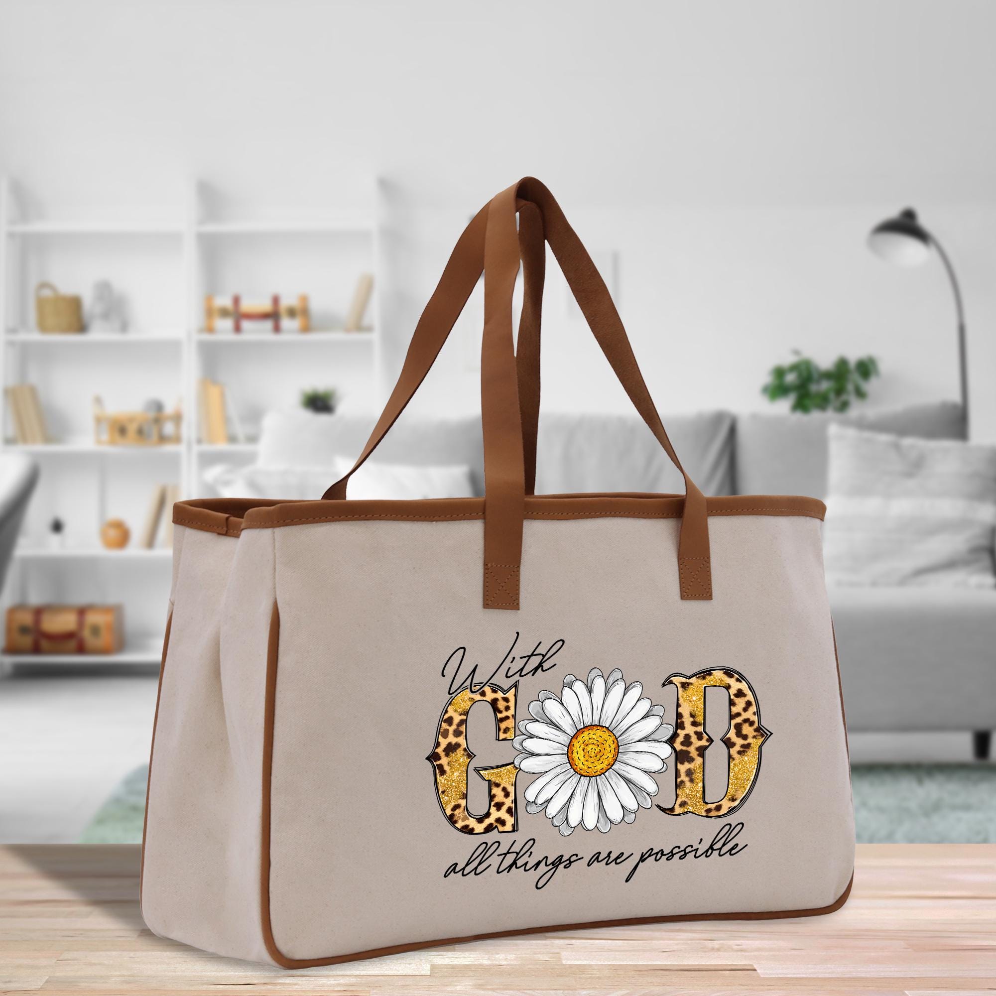 a canvas tote bag with a daisy on it