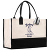 a black and white bag with a picture of a woman on it