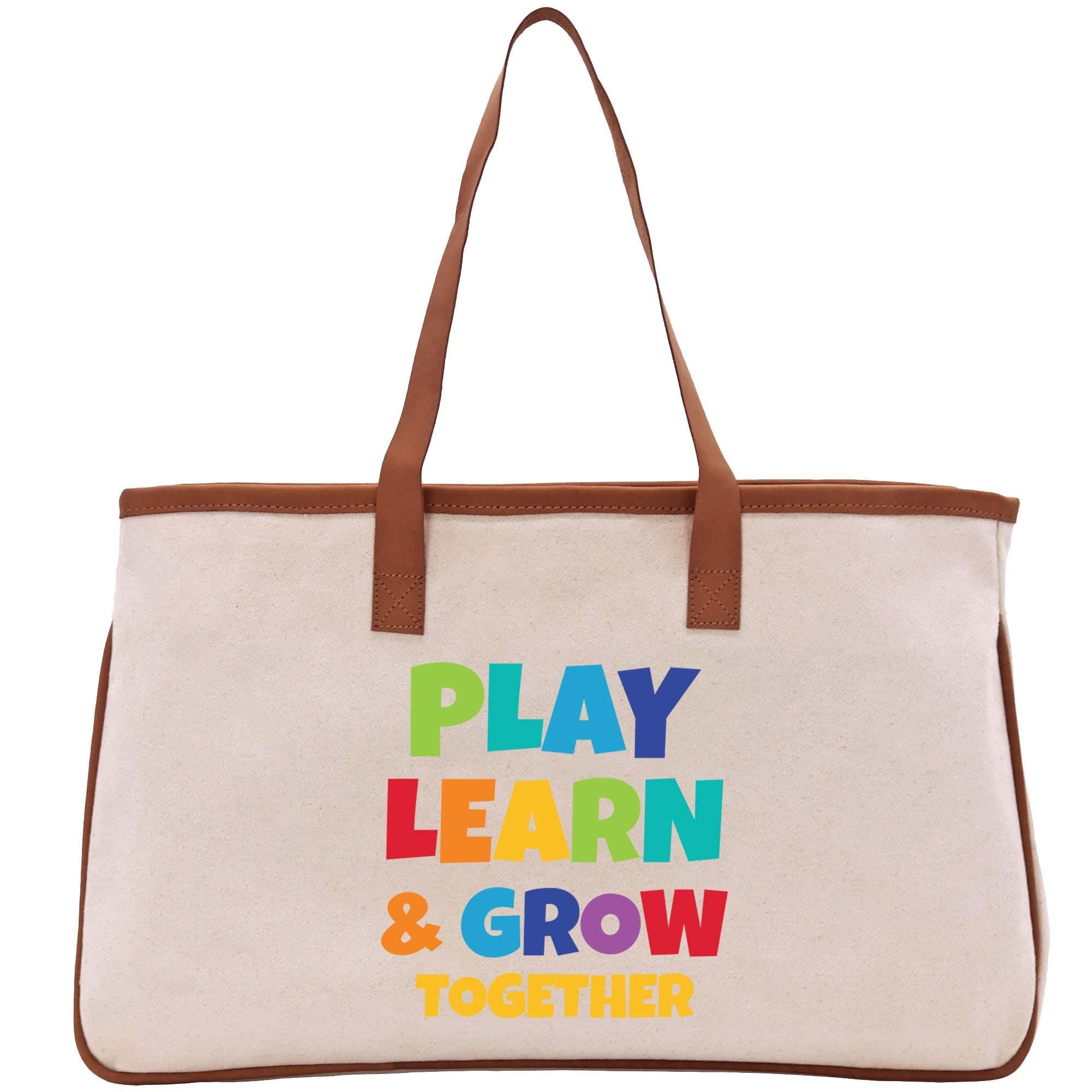 a canvas bag with the words play learn and grow together