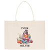a white bag with a picture of a girl reading a book