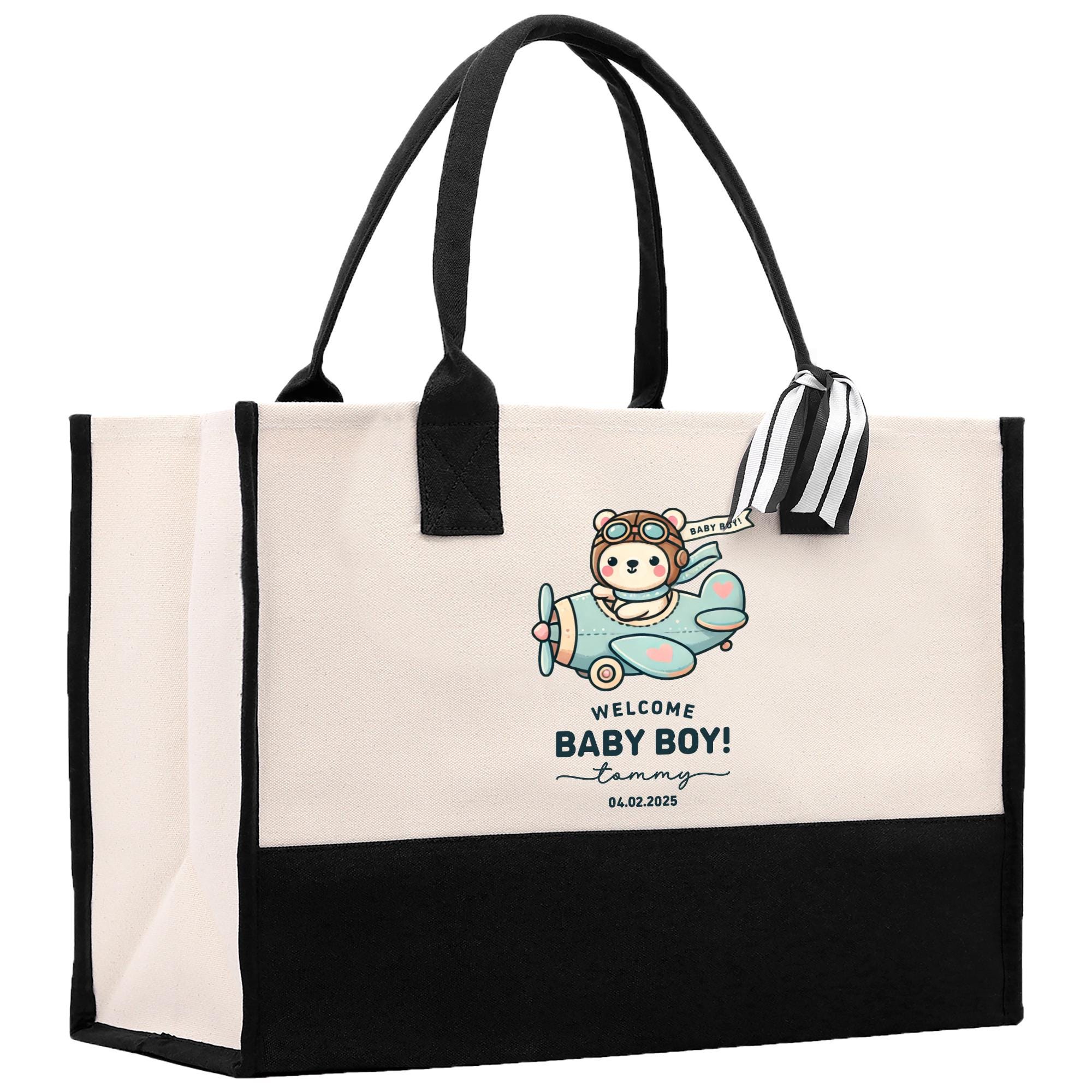 a black and white bag with a baby boy on it