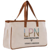 a large white bag with a brown strap