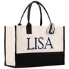 A large tote bag with a black and white color scheme, featuring the name "LISA" printed in blue letters on the front.