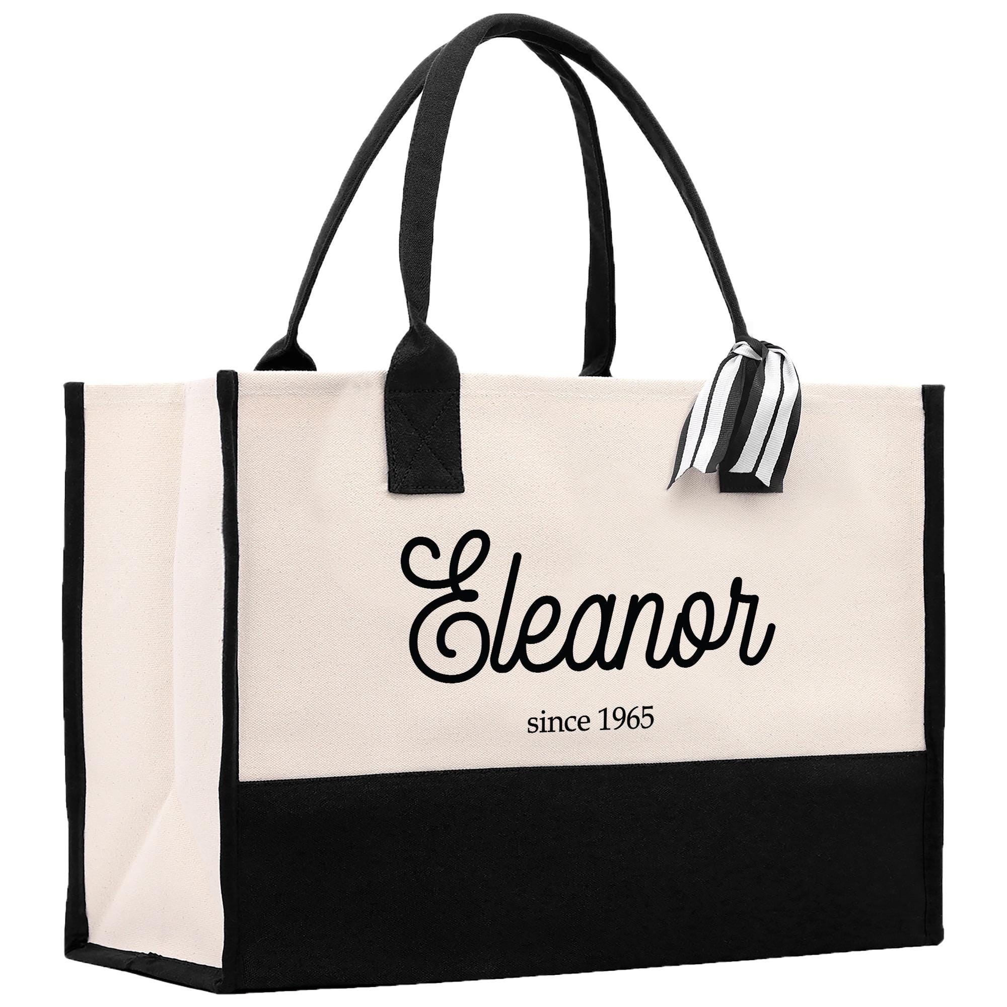 a black and white tote bag with a logo on it