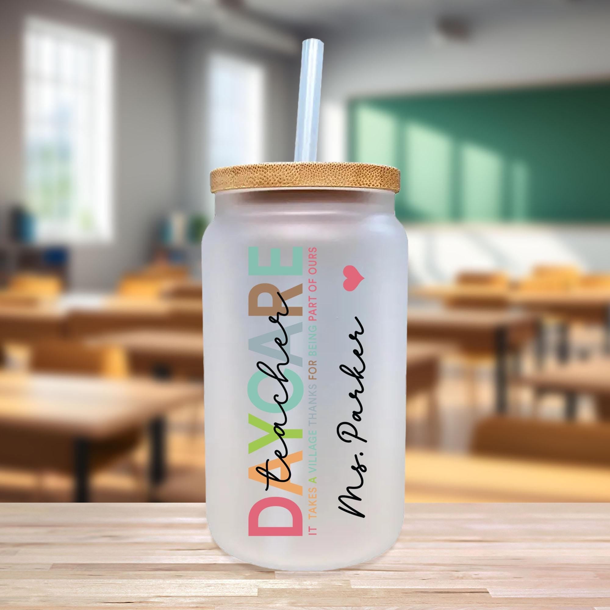 a plastic cup with a straw on a table