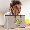 a woman sitting at a table with a bag