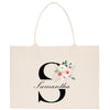 a white bag with the letter g on it