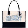 a white and black bag with a name on it