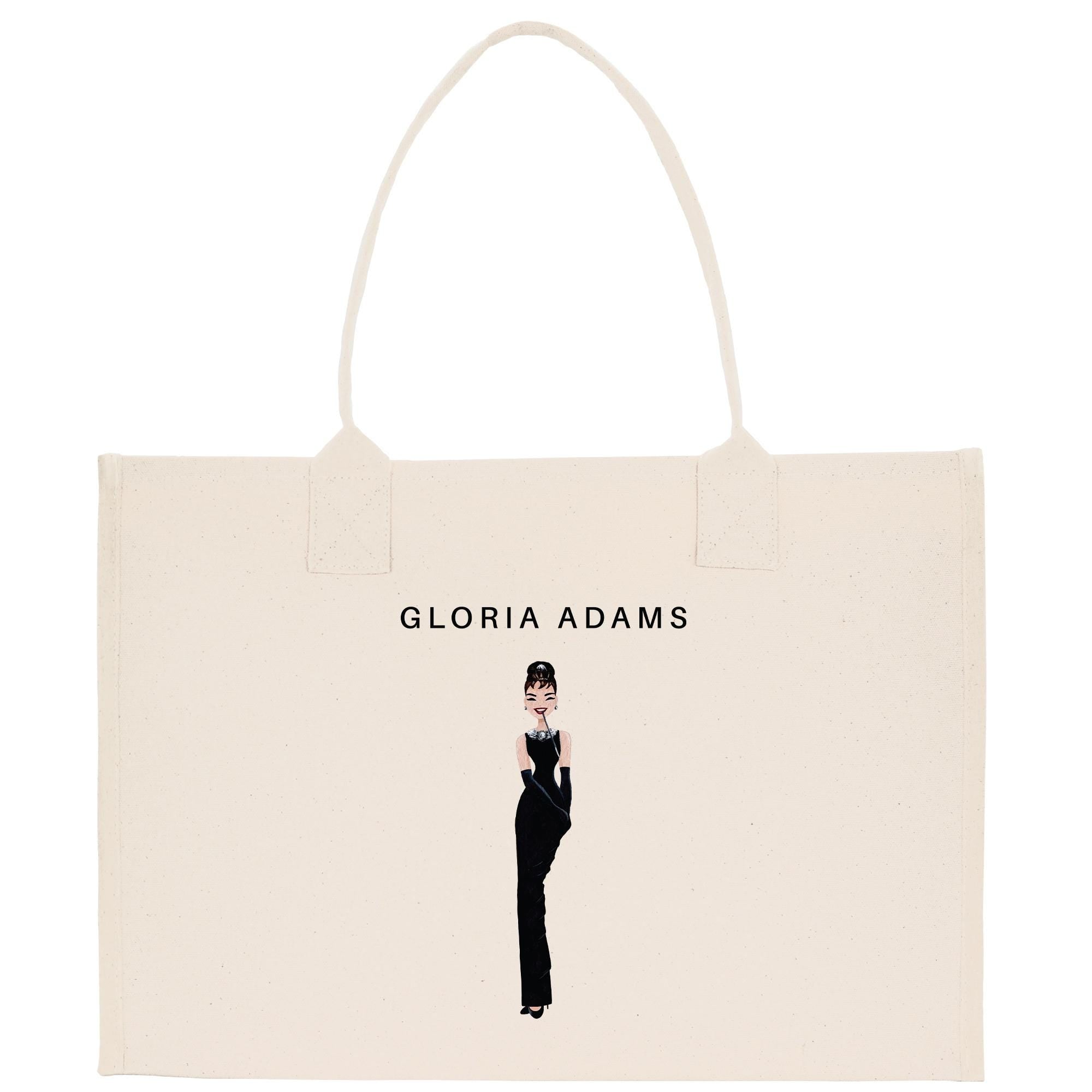 a white shopping bag with a picture of a woman in a tuxedo