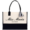 a black and white bag with a black and white ribbon