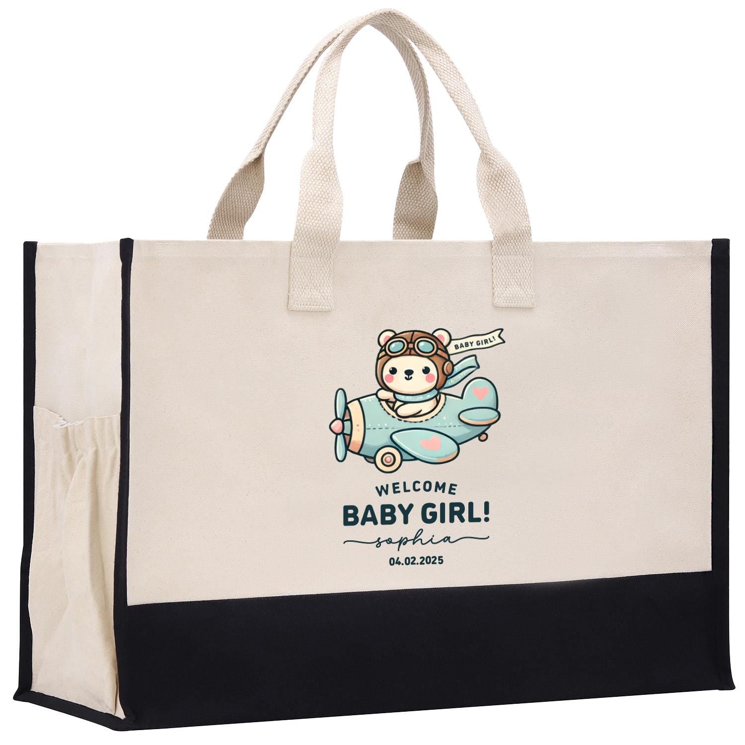 a white and black bag with a baby girl on it