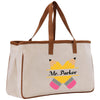 a white bag with a brown leather handle