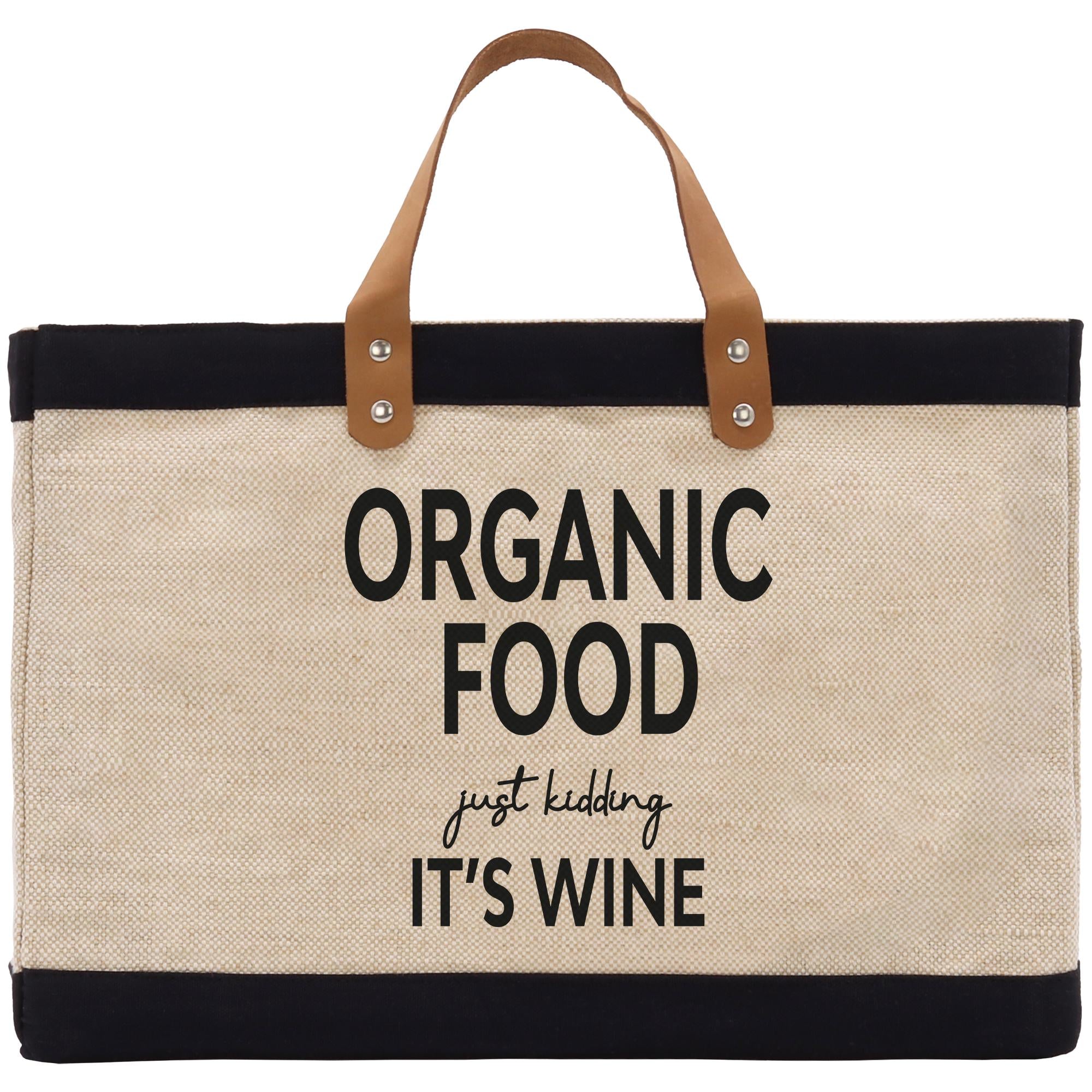 A beige tote bag with black trim and a leather handle, featuring the text &quot;ORGANIC FOOD just KIDDING IT&#39;S WINE&quot; printed on it.