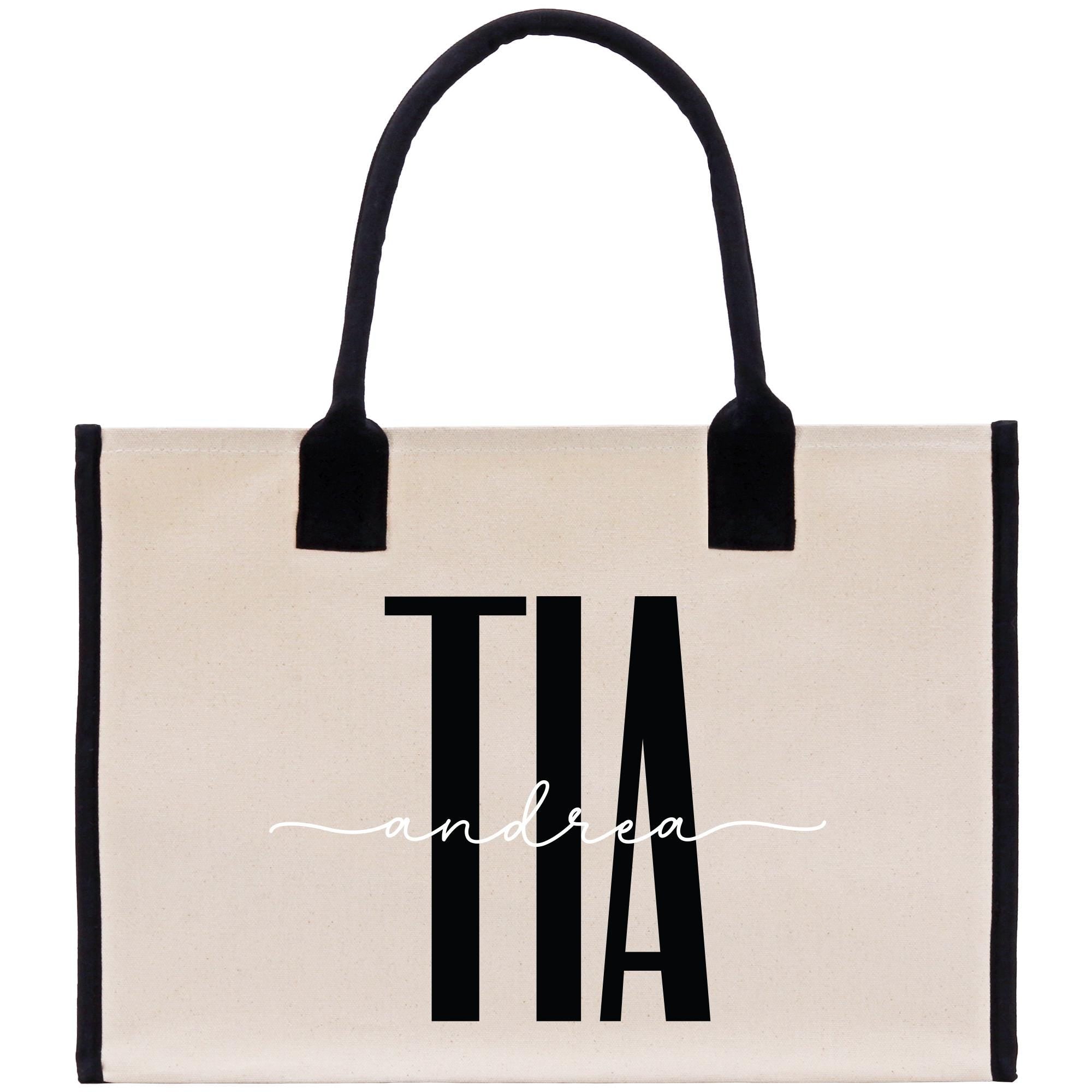 a white and black bag with a black handle