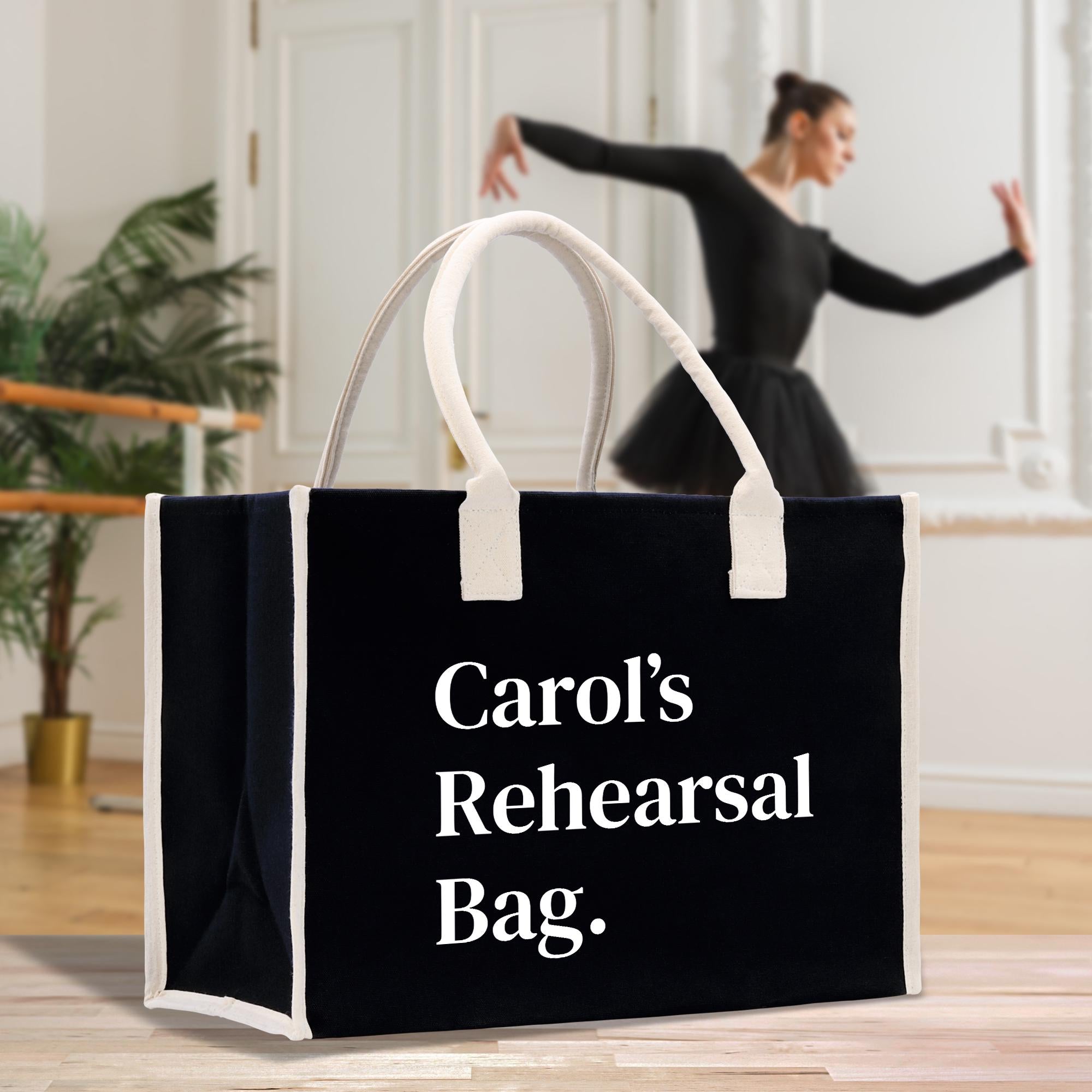 a woman in a black dress is dancing with a black and white bag