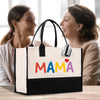 two women sitting at a table with a bag