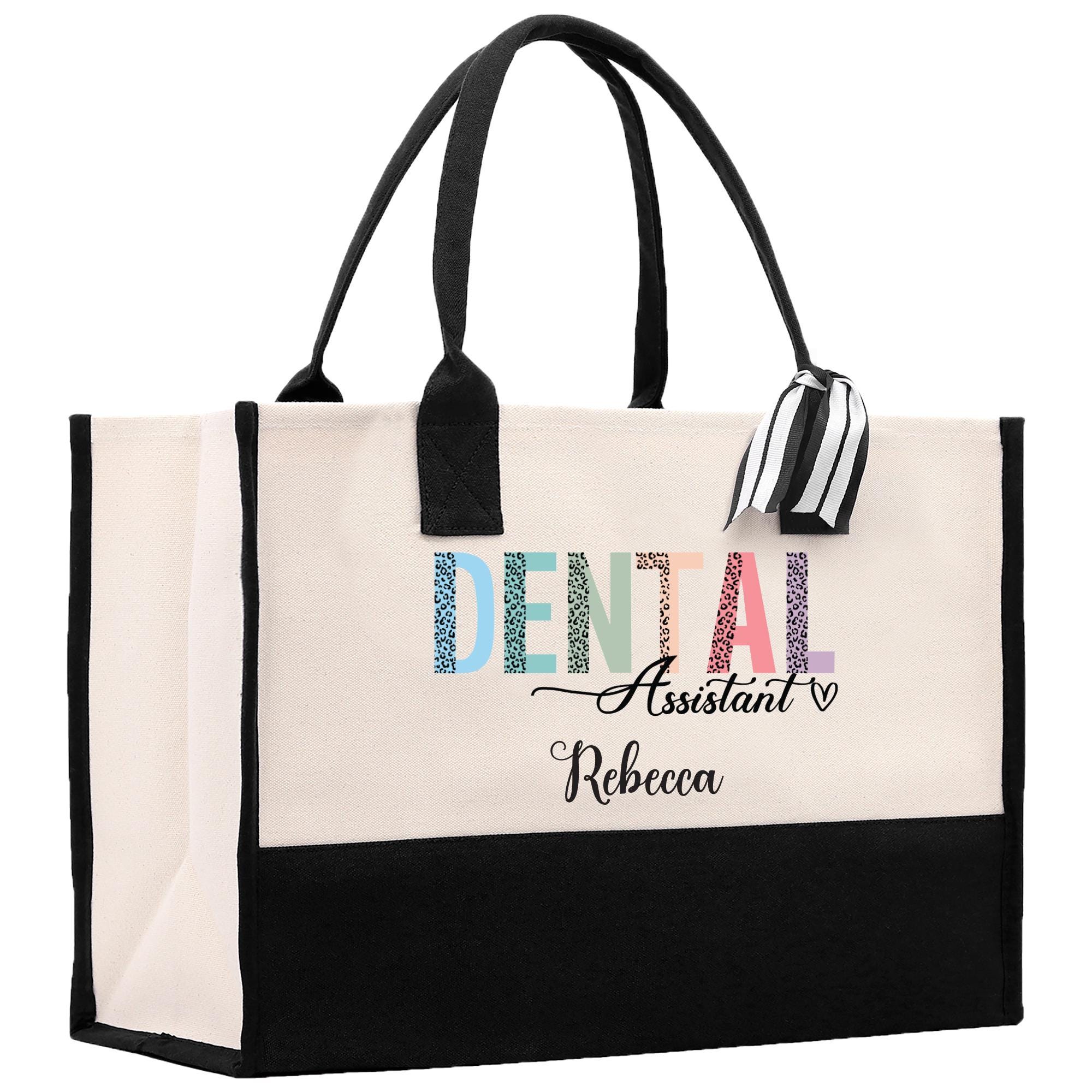 a black and white tote bag with the word dental assistant on it