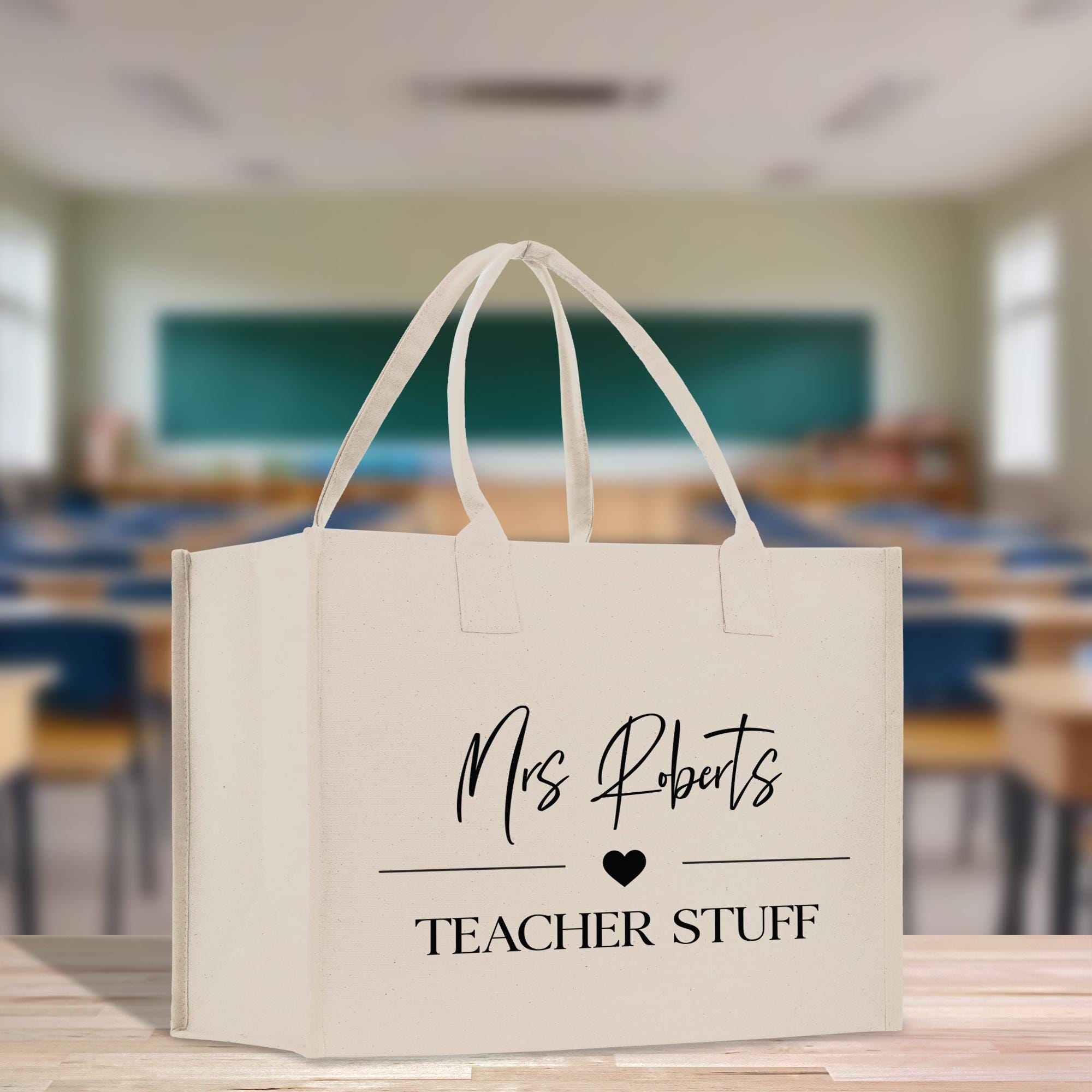 a white bag with a teacher&#39;s name on it