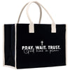 a black and white bag with the words pray, wait, trust and god has