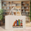 A white tote bag with a printed design of a bookshelf and the text "I HAVE NO SHELF CONTROL" printed on it.