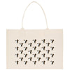a beige tote bag with a repeating pattern of dog faces printed on it.