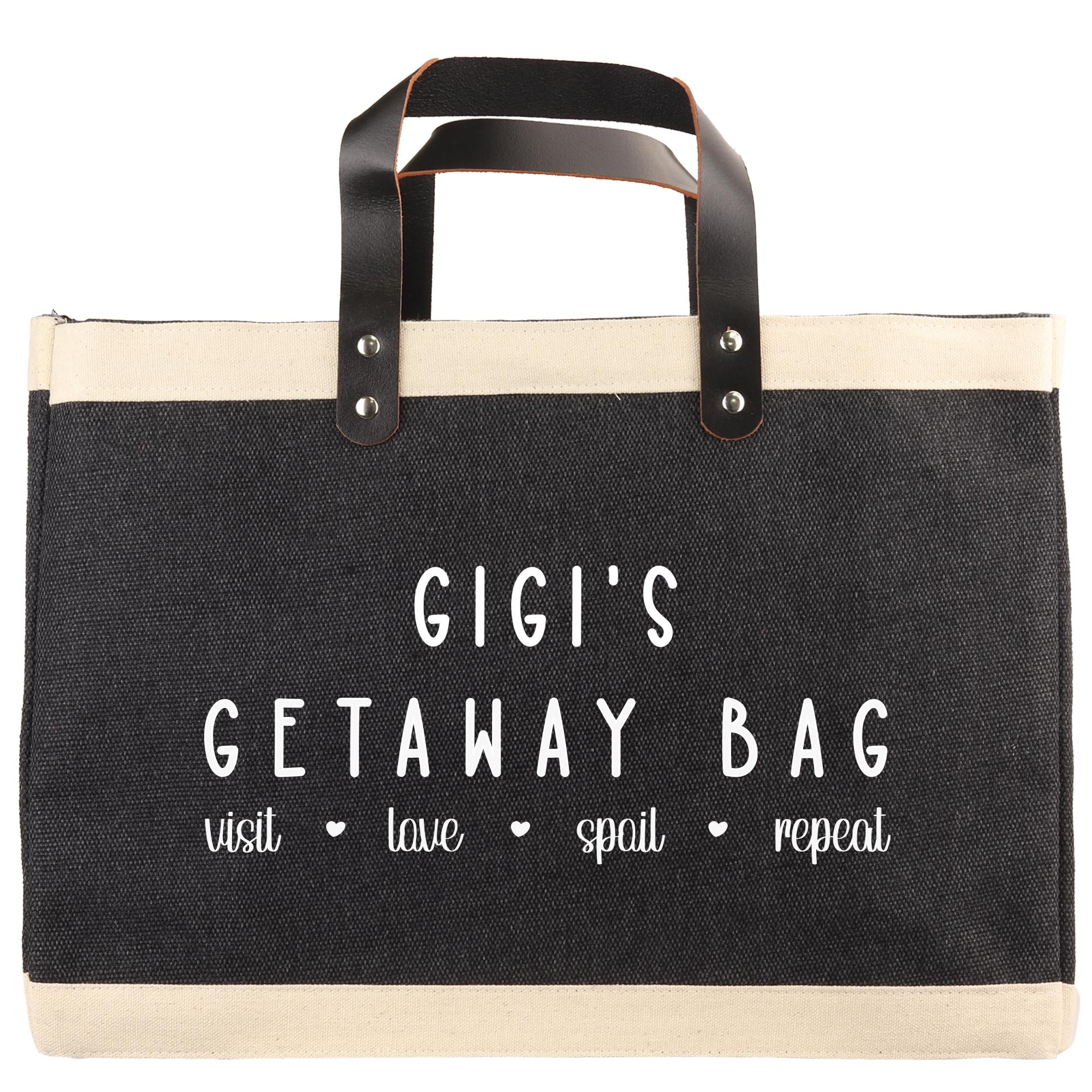The image is a black and white tote bag with the text "GIGI'S GETAWAY BAG" printed on it.