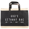 The image is a black and white tote bag with the text 