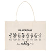 A beige canvas tote bag with a printed design featuring various flower illustrations and the text "God says you are Ashley" printed on it.