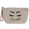 a white bag with eyelashes and the word elizabeth on it