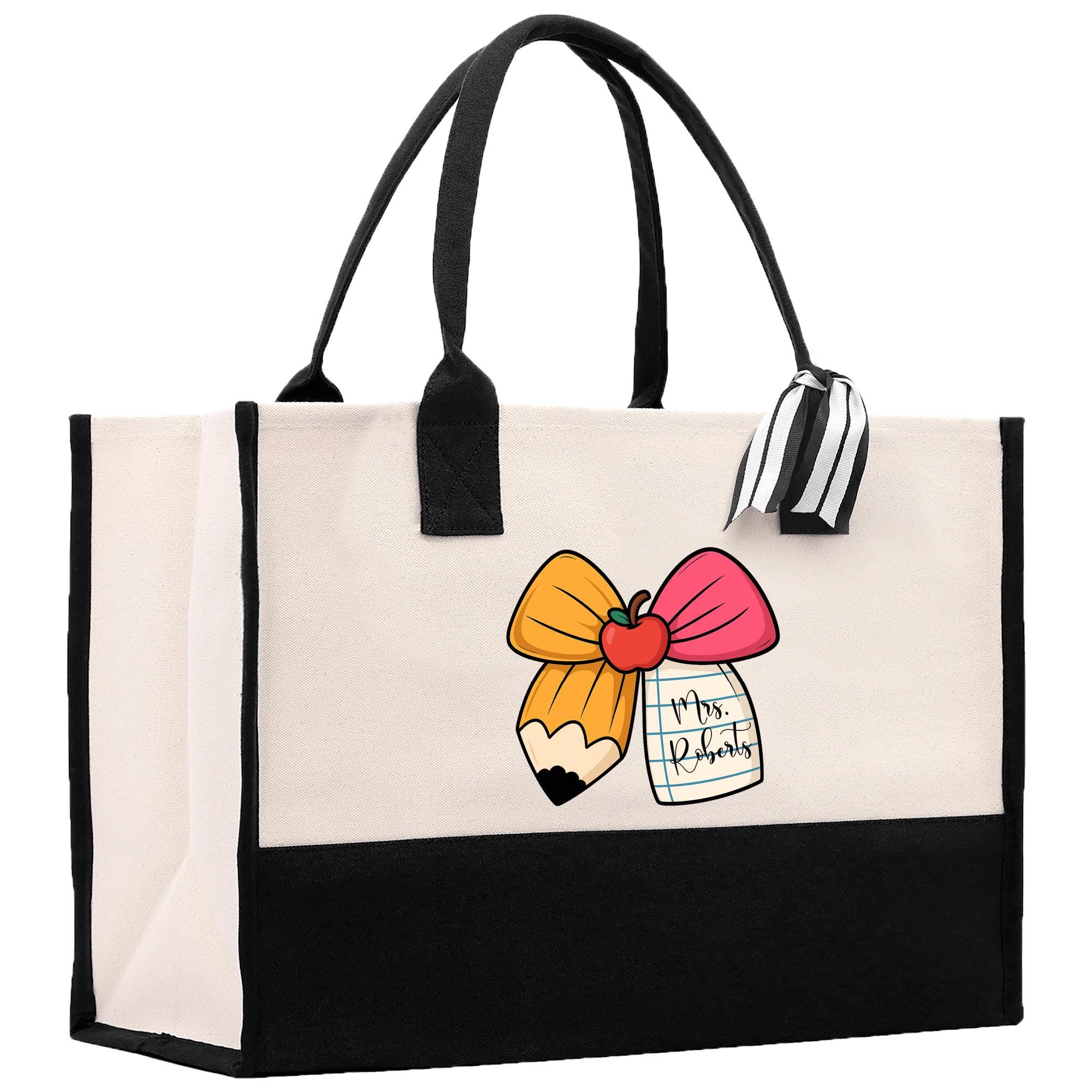 A large tote bag with a black and white striped handle and a colorful pencil design on the front.