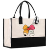 A large tote bag with a black and white striped handle and a colorful pencil design on the front.