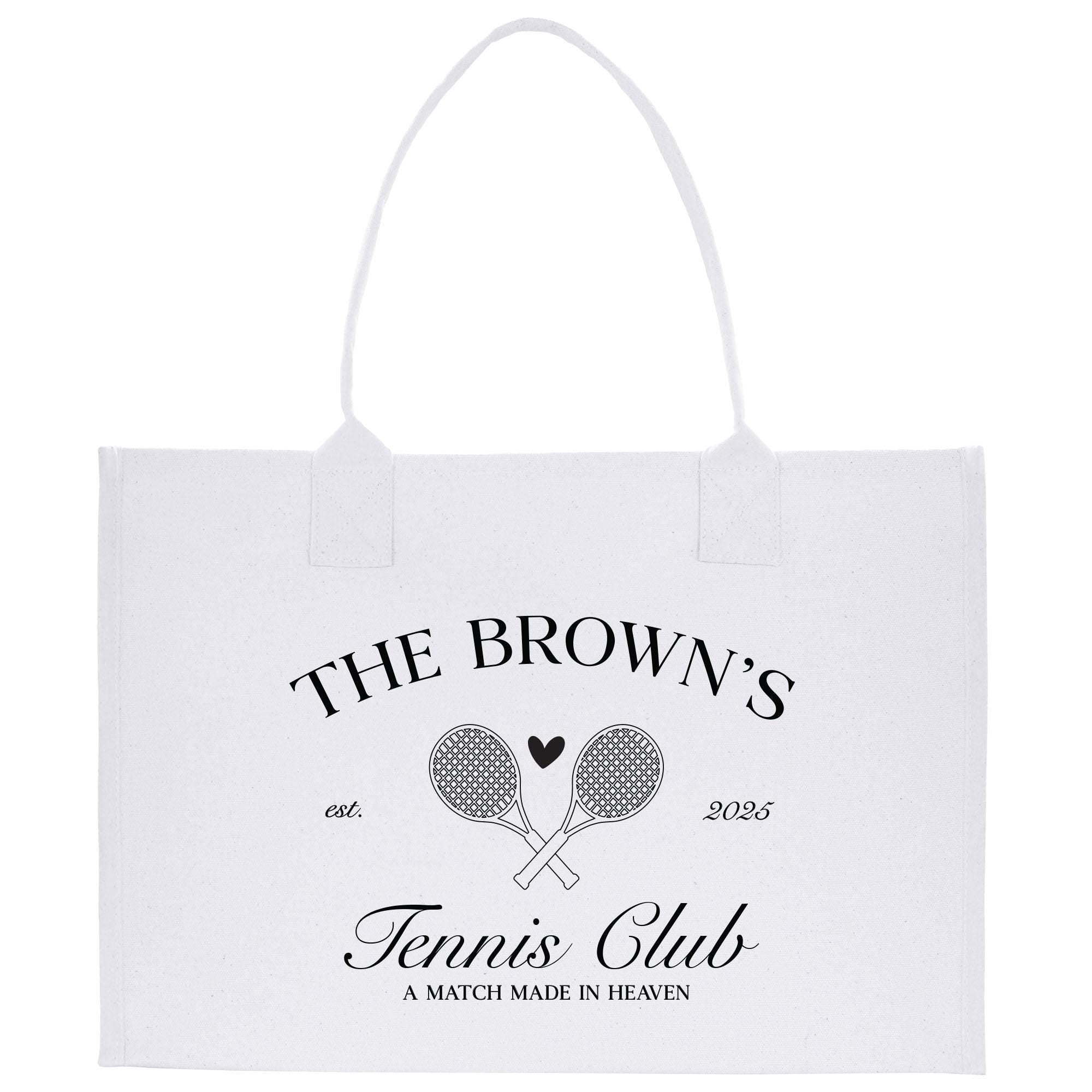 A white tote bag with black text and graphics, including tennis rackets and a heart symbol.