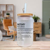 a white jar with a straw, placed on a wooden surface. The jar has a label that provides a definition of a "notary seal dealer" in a humorous and creative manner.