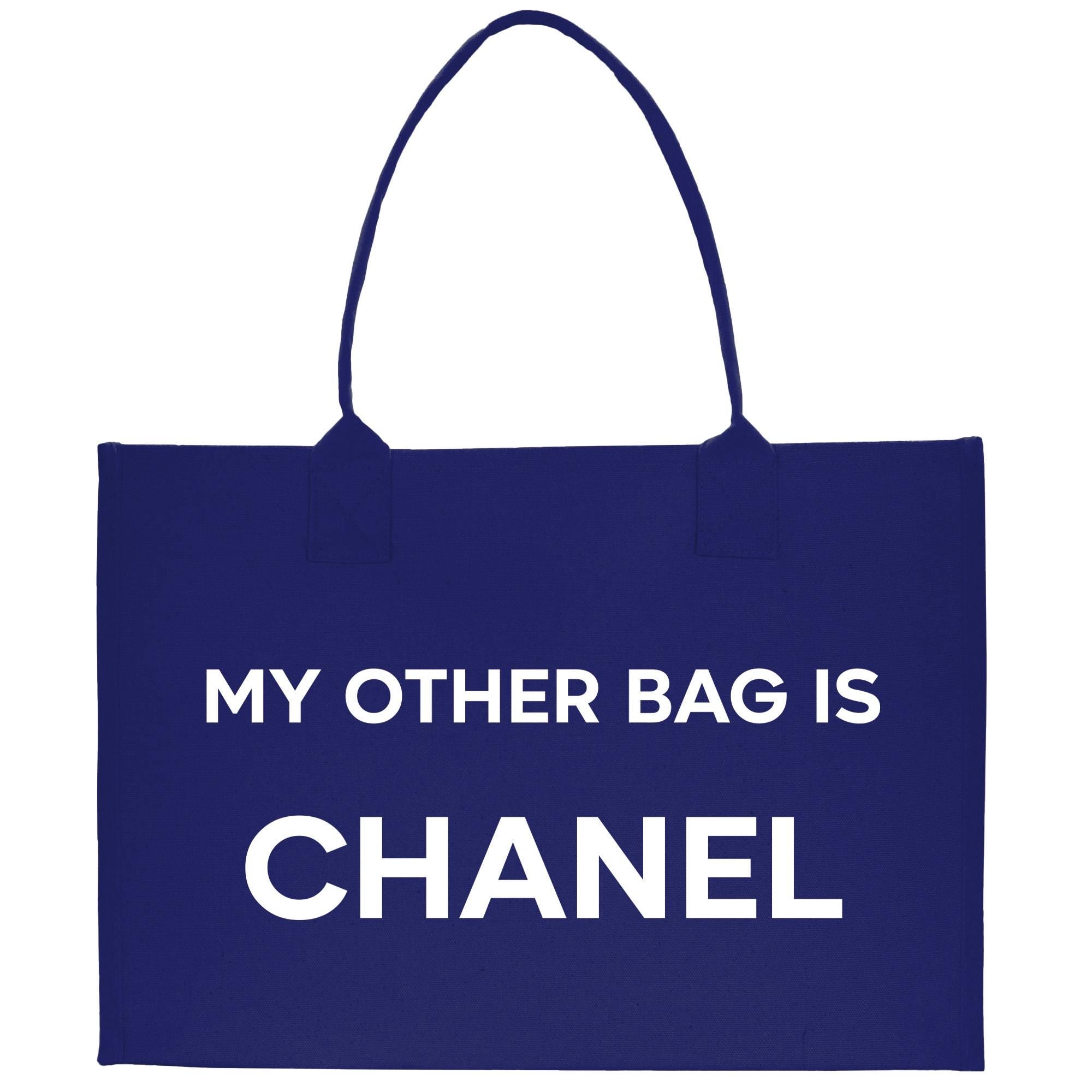 a blue bag that says, my other bag is chanel