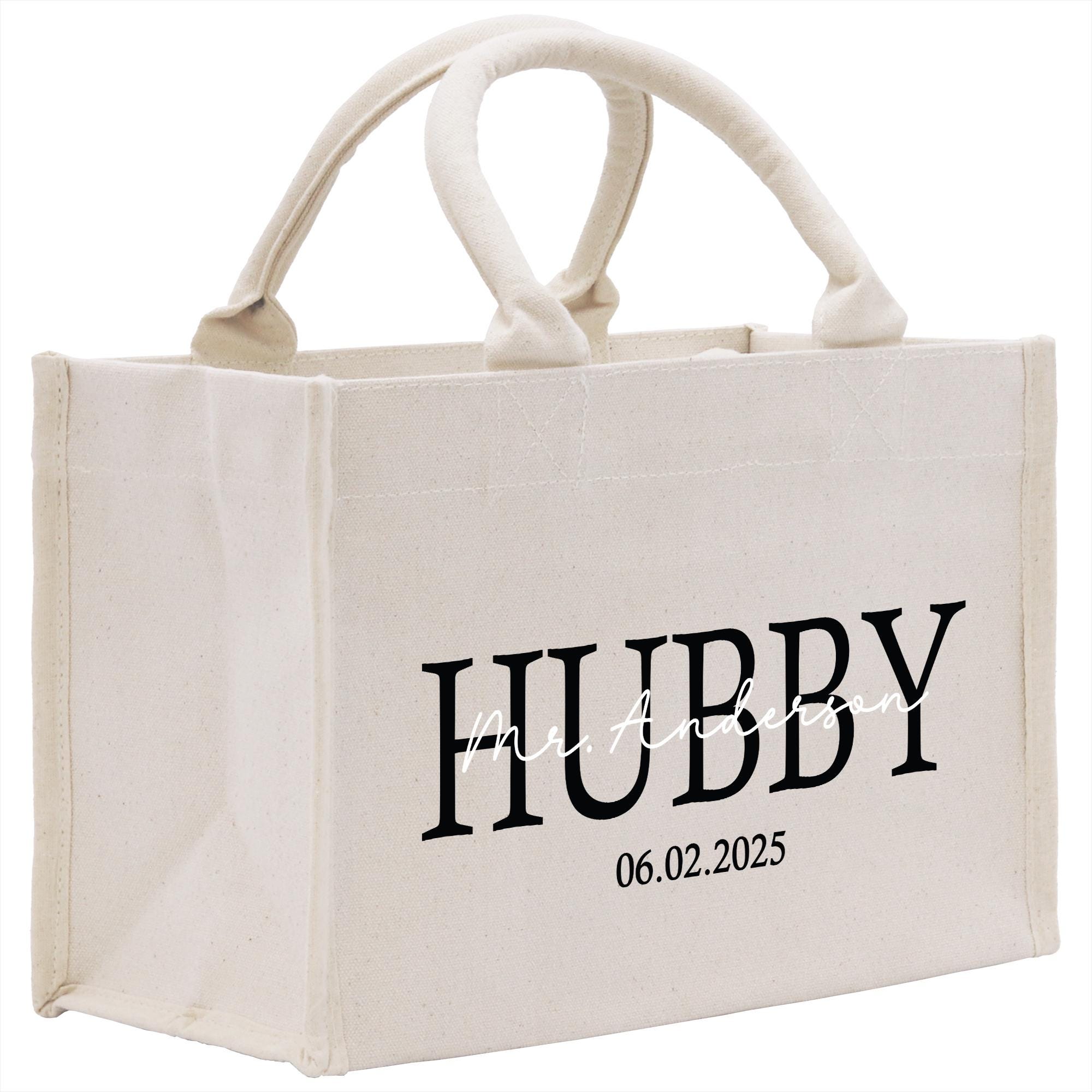 a white shopping bag with the word hubby printed on it