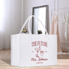 a white bag sitting on top of a wooden floor
