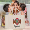 a mother kissing her two children on the cheek