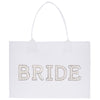 A white tote bag with the word "BRIDE" printed on it in large, glittery letters.