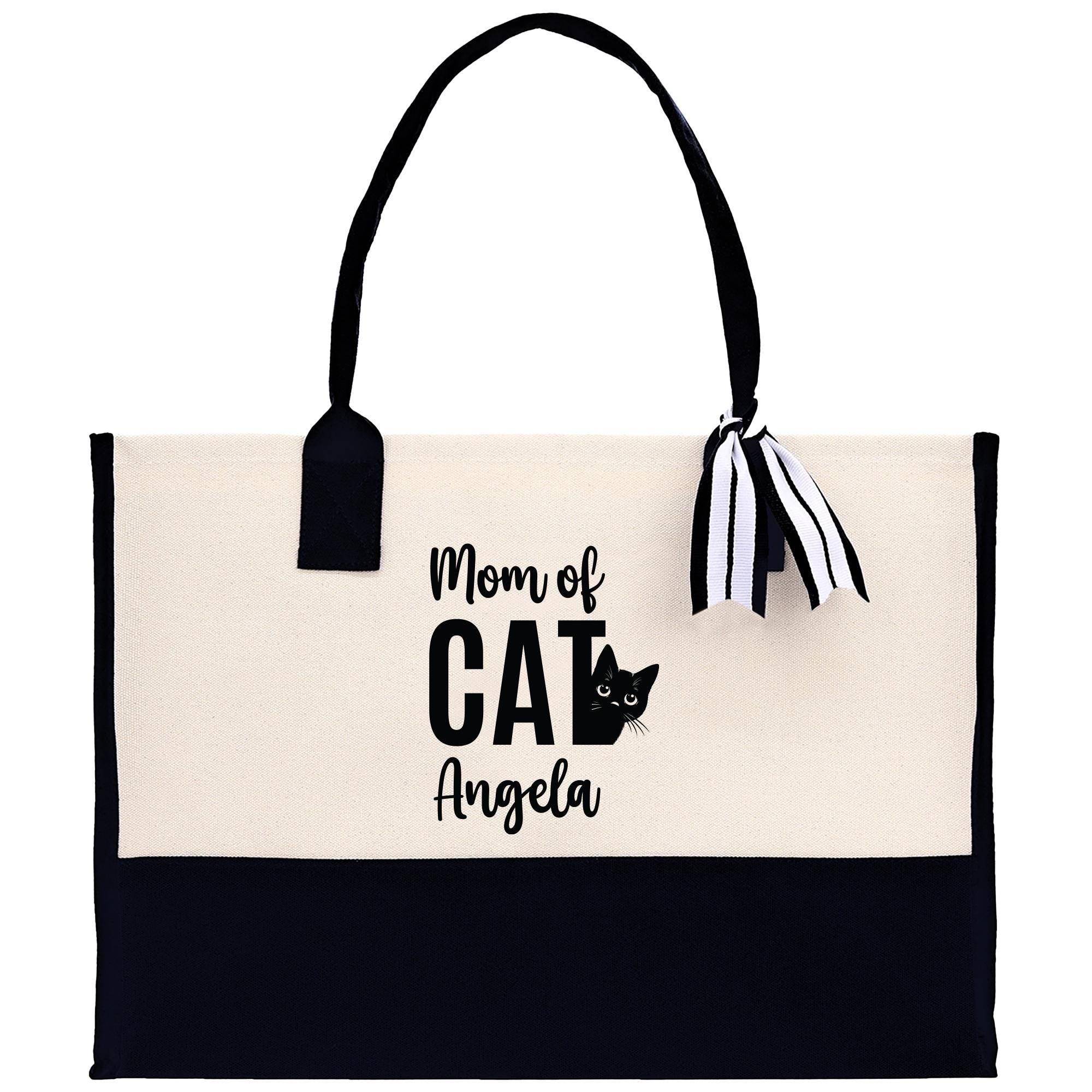 a black and white bag with a cat on it