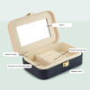 a black suitcase with a mirror inside of it