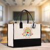 a black and white bag with a rainbow on it