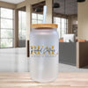 a glass jar with a straw inside of it